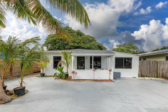 view of front of home with fence and stucco siding