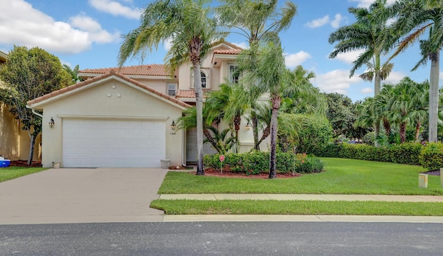 mediterranean / spanish-style home featuring a garage, concrete driveway, stucco siding, a tile roof, and a front yard