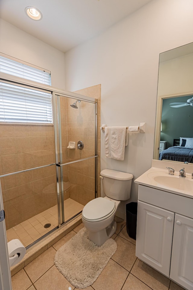 full bath featuring a stall shower, toilet, ensuite bath, tile patterned flooring, and vanity