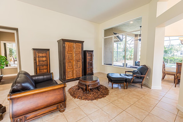living room with light tile patterned floors and baseboards