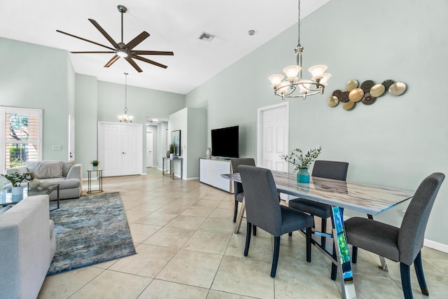 dining room with high vaulted ceiling, visible vents, a notable chandelier, and light tile patterned flooring