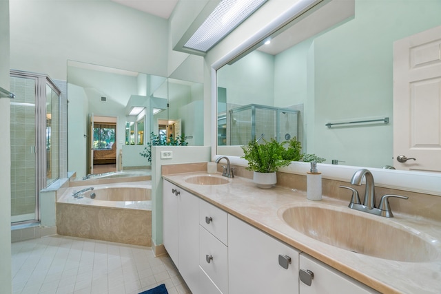 full bath with tile patterned flooring, a garden tub, a sink, and a shower stall