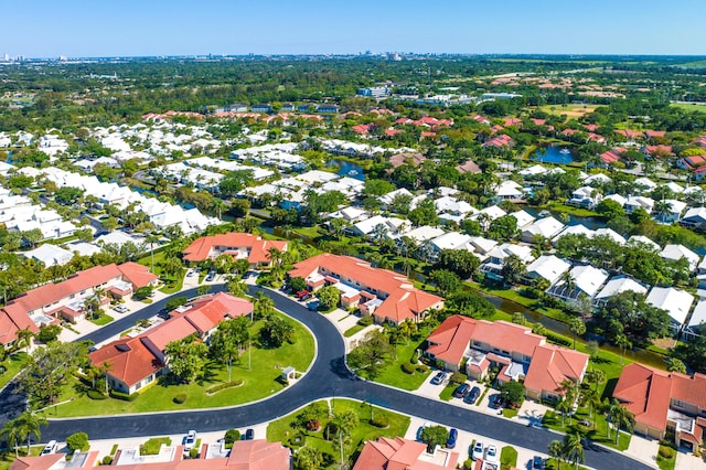 drone / aerial view featuring a residential view and a water view