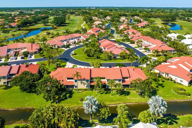 bird's eye view with a residential view, view of golf course, and a water view