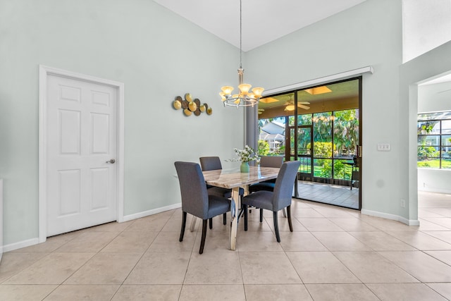 dining space with high vaulted ceiling, light tile patterned flooring, and baseboards