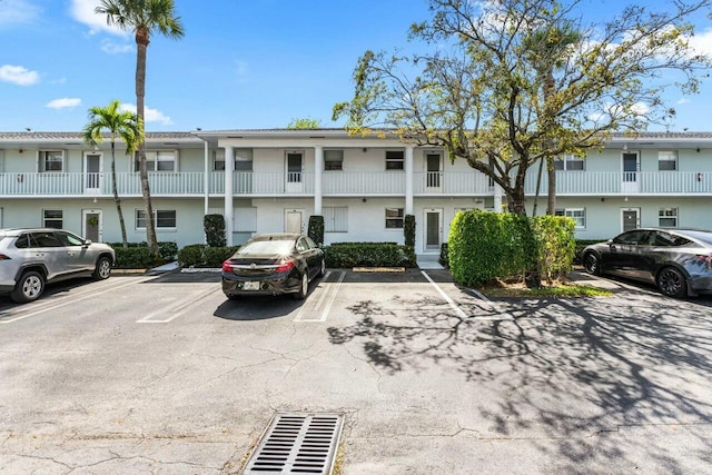 view of property featuring uncovered parking