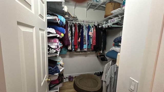 spacious closet with wood finished floors