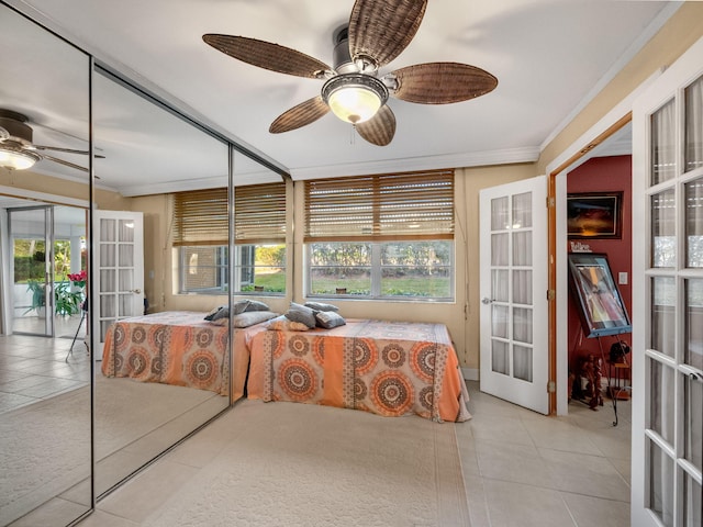 bedroom with access to exterior, french doors, ornamental molding, and tile patterned floors