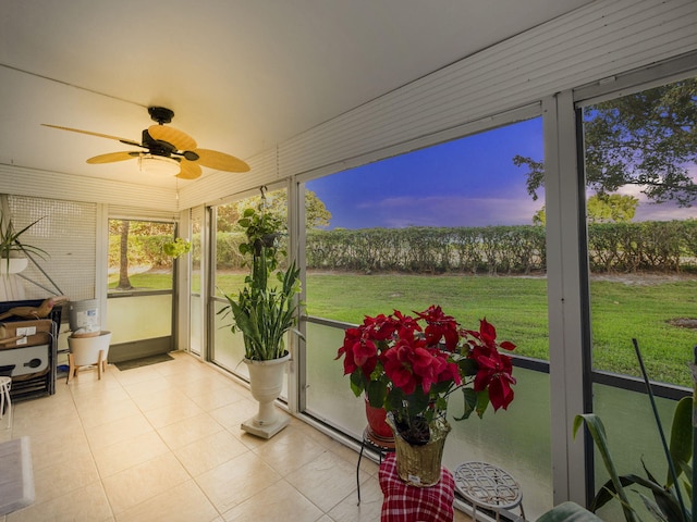 sunroom with a ceiling fan