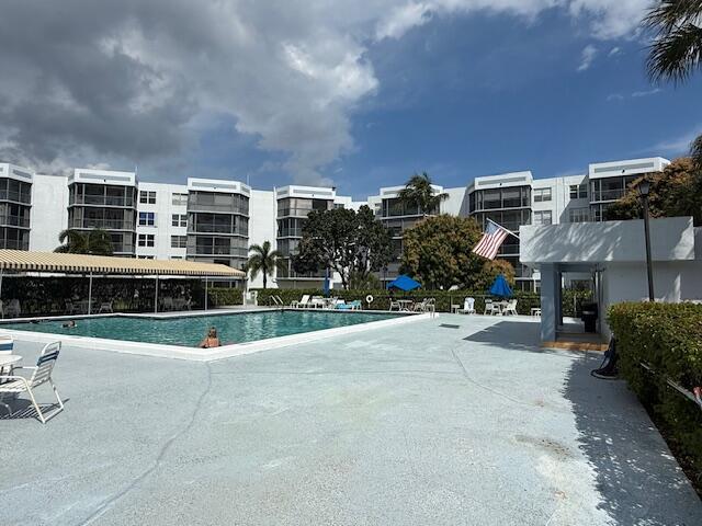 community pool with a patio area