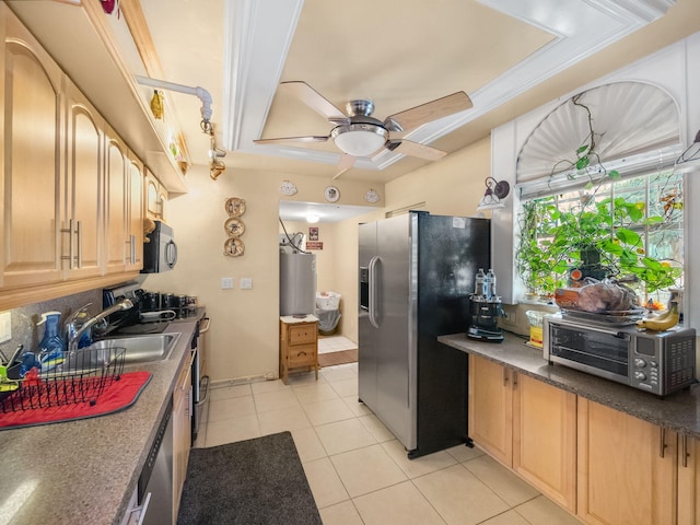 kitchen featuring light tile patterned floors, a ceiling fan, light brown cabinets, black microwave, and stainless steel fridge