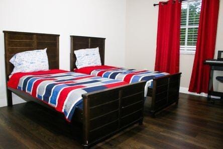 bedroom featuring wood finished floors