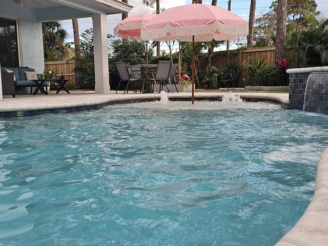 view of swimming pool with a patio area, a fenced backyard, and a fenced in pool