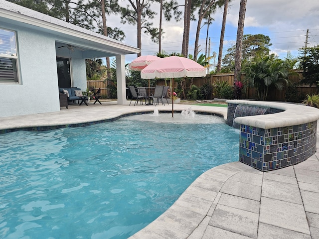 view of swimming pool with a patio area, a fenced backyard, ceiling fan, and a fenced in pool