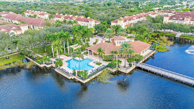 drone / aerial view with a water view and a residential view