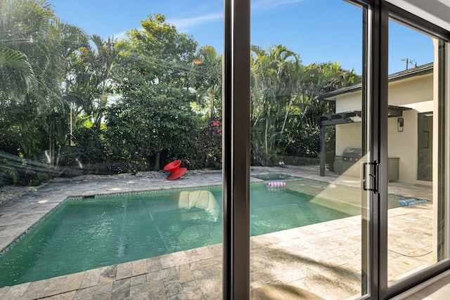 outdoor pool with a patio