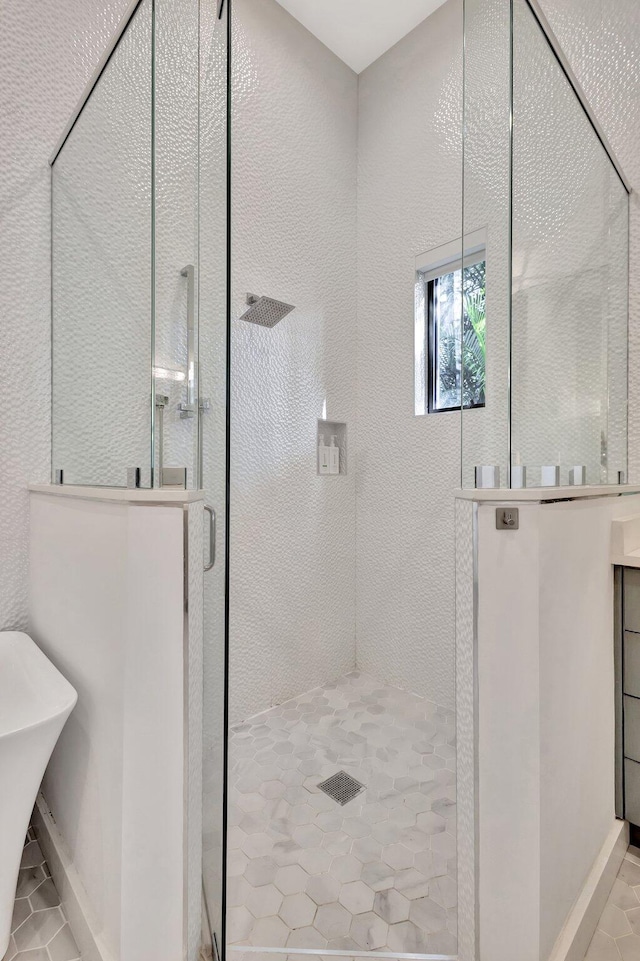 full bathroom with a soaking tub, tile patterned flooring, a walk in shower, and a textured wall