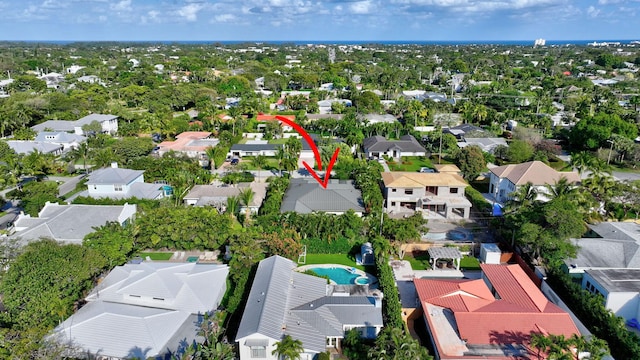 birds eye view of property with a residential view