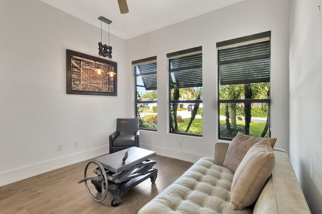 sitting room with wood finished floors and baseboards