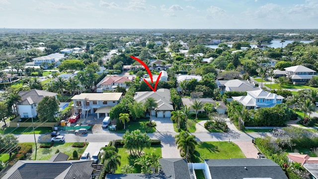 aerial view featuring a residential view and a water view