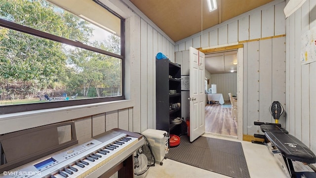 misc room featuring wooden walls