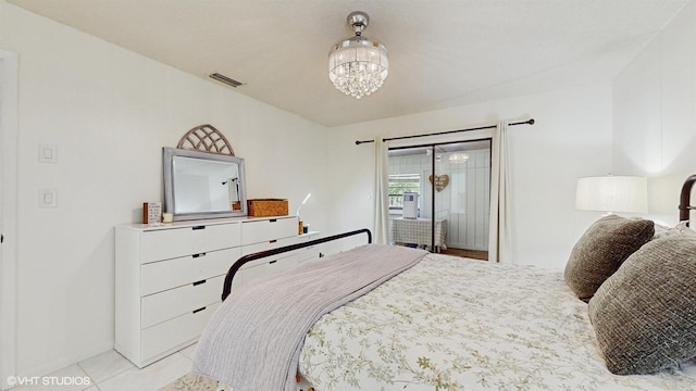 bedroom featuring a chandelier, baseboards, light tile patterned floors, and access to exterior