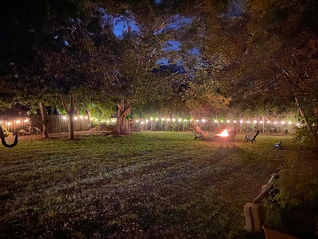 view of yard with an outdoor fire pit