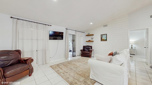 living area with vaulted ceiling, light tile patterned floors, and recessed lighting