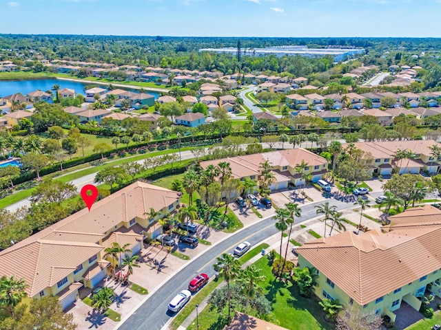 birds eye view of property featuring a water view and a residential view