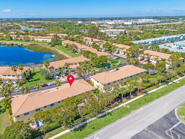 birds eye view of property featuring a water view and a residential view