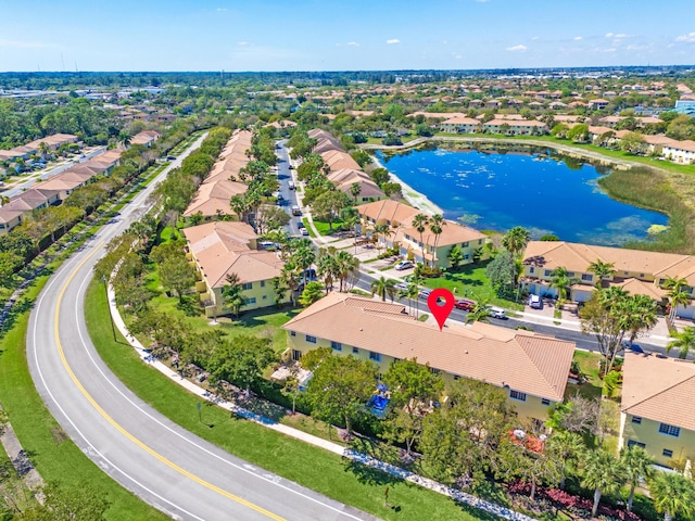 drone / aerial view with a water view and a residential view