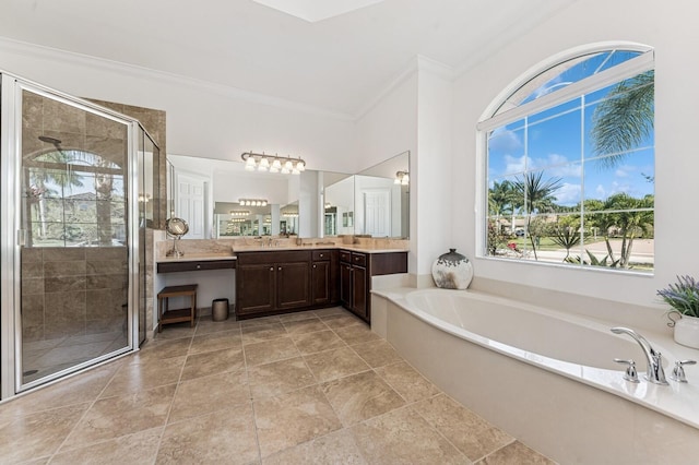 bathroom with a bath, a stall shower, crown molding, and vanity