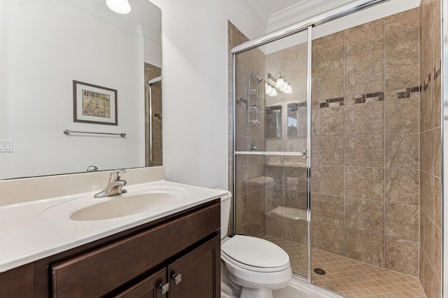 full bath featuring toilet, a stall shower, ornamental molding, and vanity