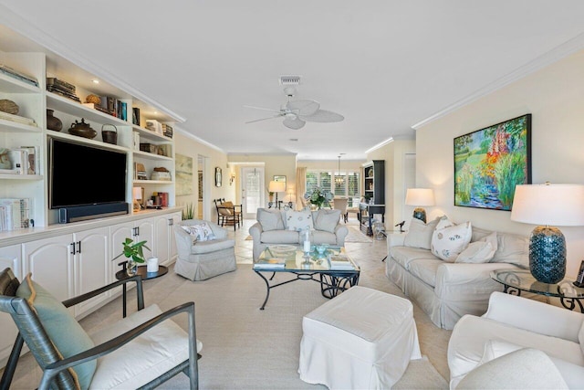 living area featuring ceiling fan, visible vents, and crown molding