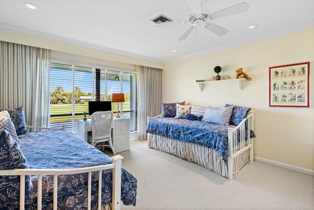 carpeted bedroom with baseboards, visible vents, and ornamental molding