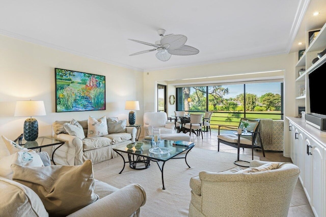 living area featuring light tile patterned floors, ornamental molding, and a ceiling fan