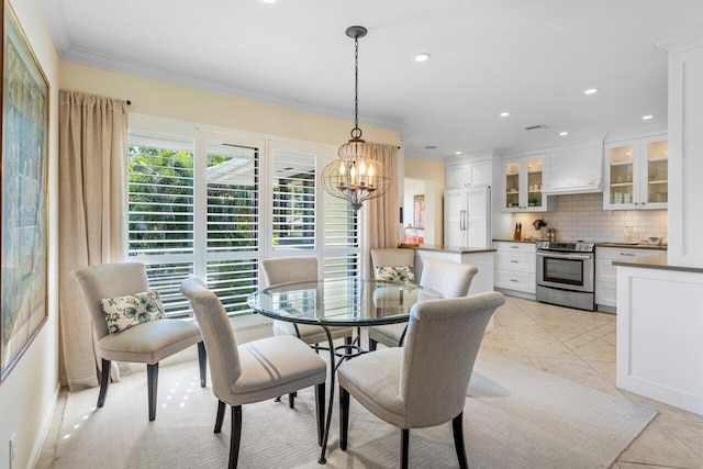 dining area with ornamental molding, light tile patterned flooring, an inviting chandelier, and recessed lighting