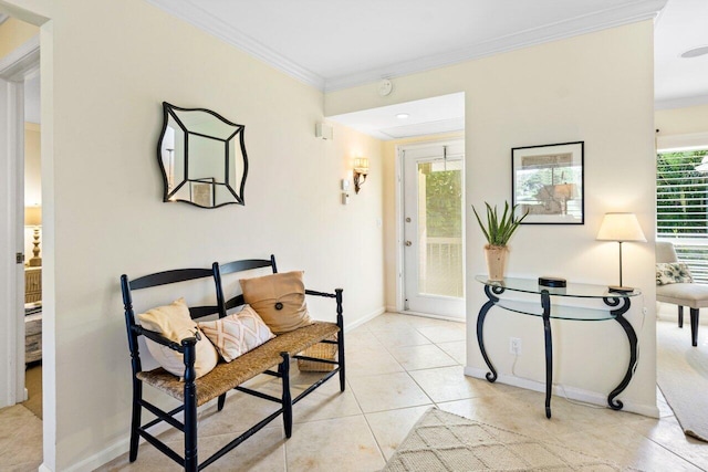 sitting room with ornamental molding, light tile patterned flooring, and baseboards