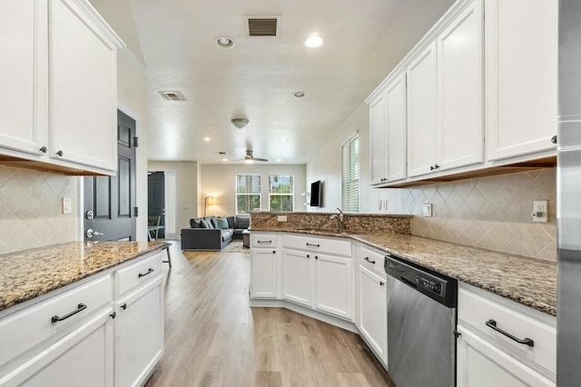 kitchen featuring dishwasher, white cabinets, visible vents, and light wood finished floors