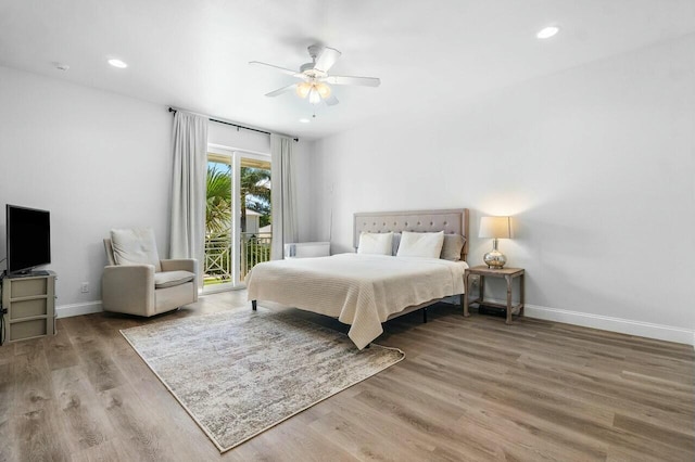 bedroom with access to exterior, ceiling fan, baseboards, recessed lighting, and wood finished floors