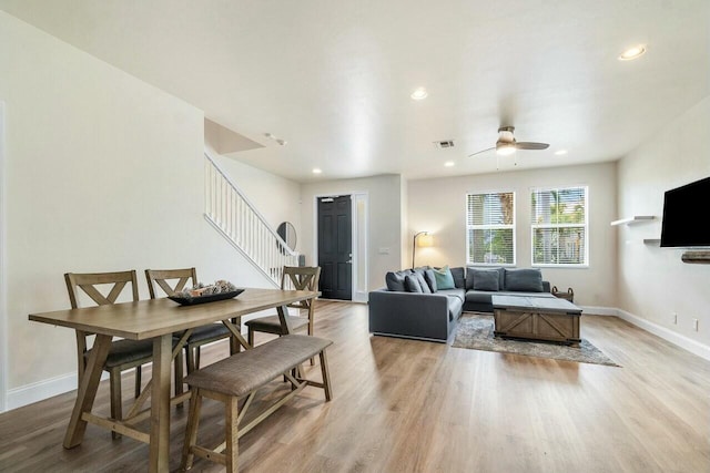 dining space with visible vents, recessed lighting, stairway, light wood-style floors, and baseboards