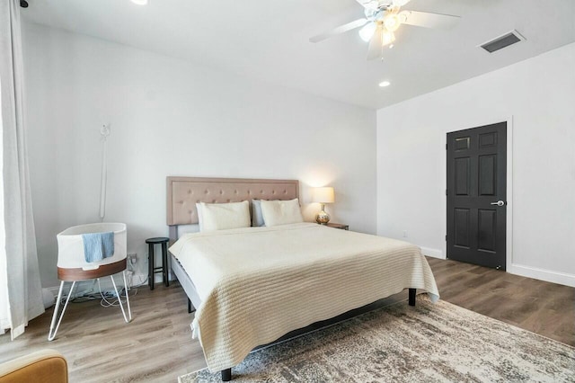 bedroom with visible vents, wood finished floors, recessed lighting, baseboards, and ceiling fan