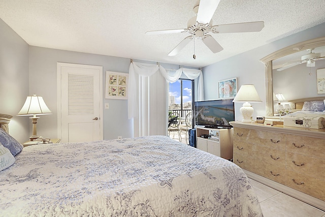 bedroom featuring access to exterior, ceiling fan, a textured ceiling, and tile patterned floors