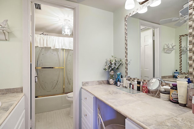 full bath featuring visible vents, bath / shower combo with glass door, ceiling fan, tile patterned floors, and vanity