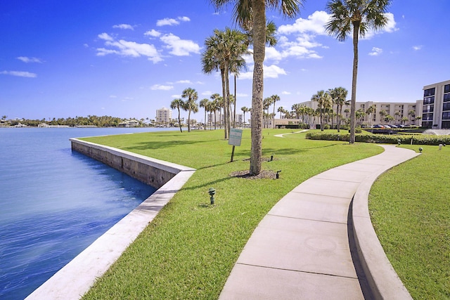 view of community featuring a water view and a lawn