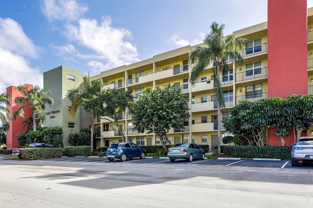 view of property featuring uncovered parking