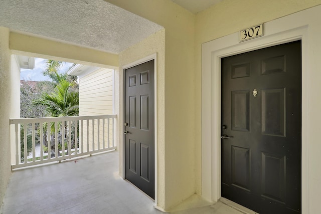 doorway to property featuring a balcony