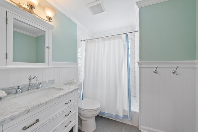 full bathroom featuring visible vents, toilet, ornamental molding, wainscoting, and vanity