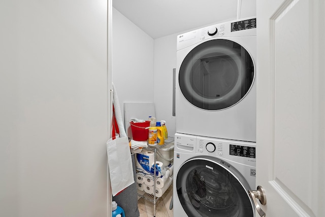 laundry room with laundry area and stacked washing maching and dryer