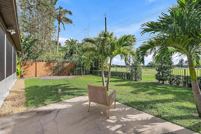 view of yard featuring a patio area and a fenced backyard